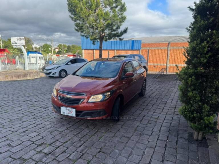 CHEVROLET - ONIX - 2013/2013 - Laranja - R$ 45.000,00